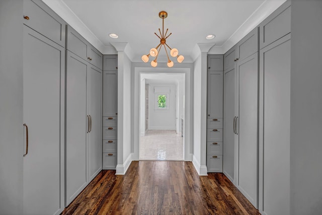 interior space featuring recessed lighting, baseboards, dark wood finished floors, and a notable chandelier