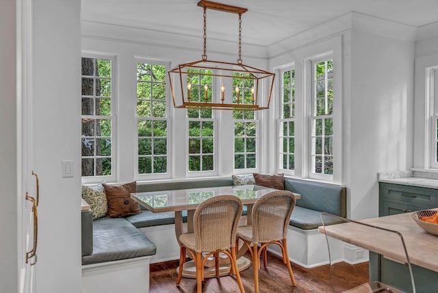 sunroom / solarium featuring french doors and a notable chandelier