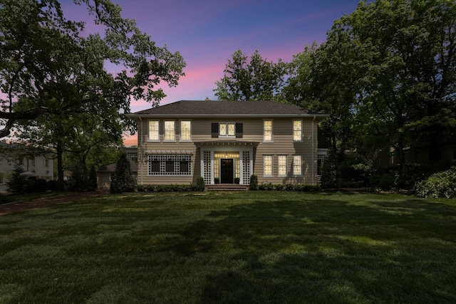 view of front of house with a yard
