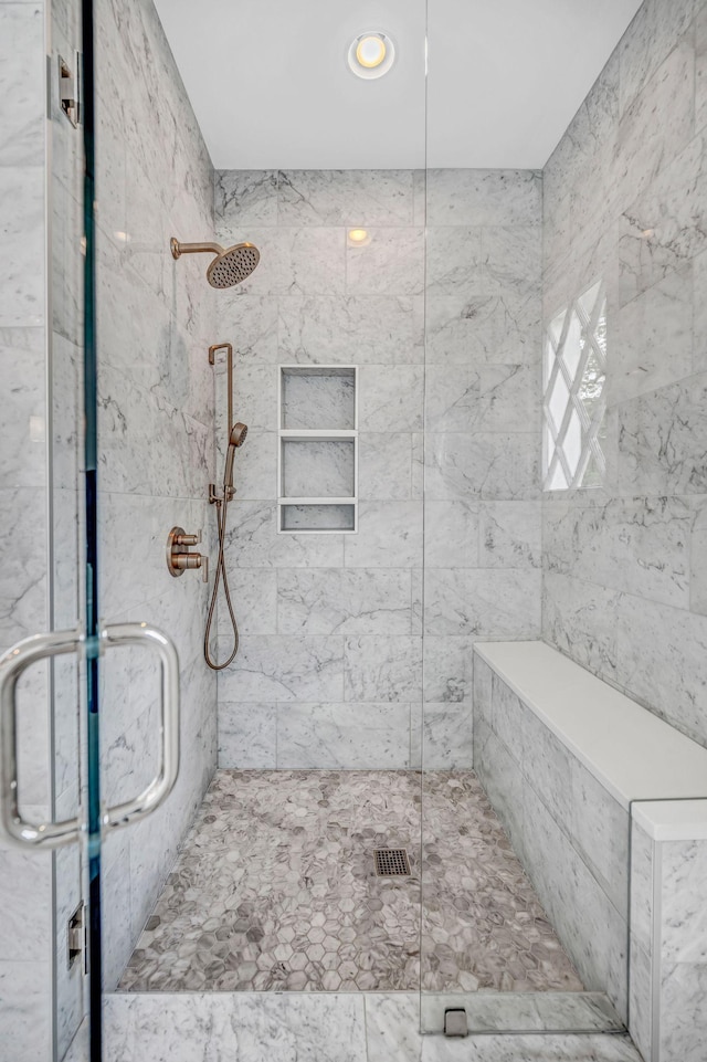 bathroom with recessed lighting and a shower stall