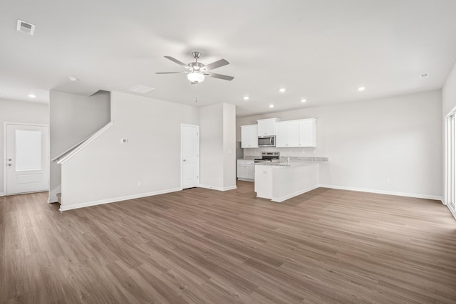 2020 Lala Loop, White Bluff, TN 37187 - unfurnished living room with baseboards, a ceiling fan, wood finished floors, and visible vents
