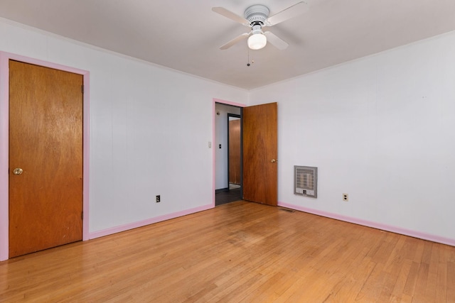 1759 Summertown Hwy, Hohenwald, TN 38462 - unfurnished bedroom with crown molding, heating unit, and light wood-type flooring
