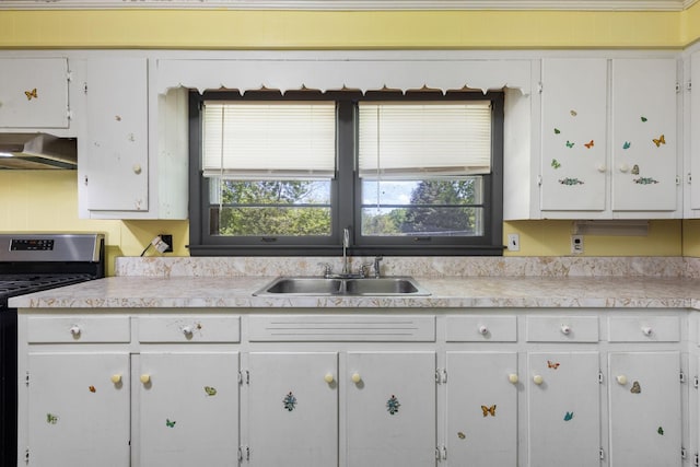 1759 Summertown Hwy, Hohenwald, TN 38462 - kitchen featuring white cabinets, a sink, light countertops, stainless steel range with gas cooktop, and under cabinet range hood