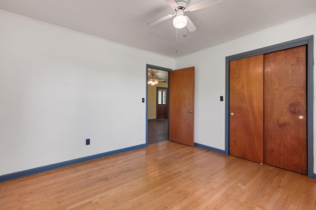 1759 Summertown Hwy, Hohenwald, TN 38462 - unfurnished bedroom featuring baseboards, ceiling fan, light wood finished floors, and a closet