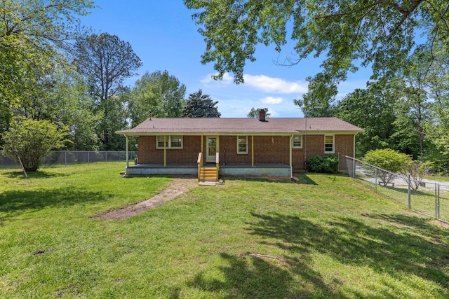 1759 Summertown Hwy, Hohenwald, TN 38462 - view of front of house featuring brick siding, a patio, a fenced backyard, and a front yard