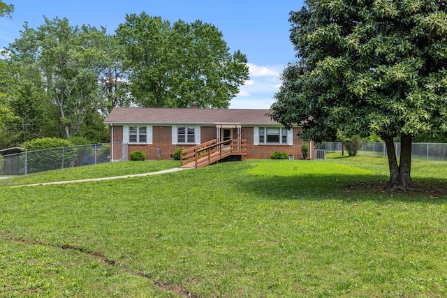 1759 Summertown Hwy, Hohenwald, TN 38462 - single story home featuring brick siding, a fenced backyard, and a front lawn