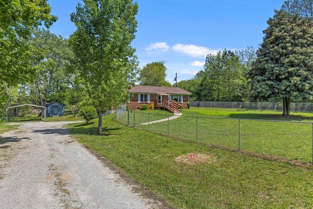 1759 Summertown Hwy, Hohenwald, TN 38462 - ranch-style house with fence, dirt driveway, a shed, an outbuilding, and a detached carport