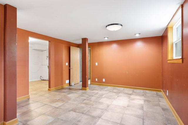 empty room with baseboards