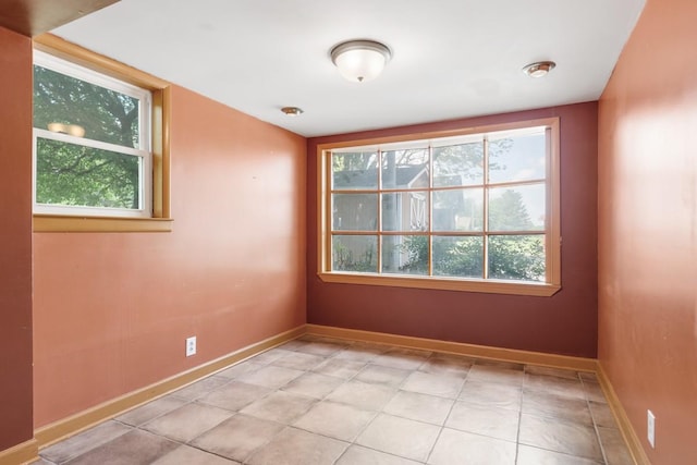 empty room featuring baseboards