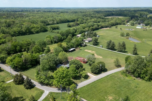 bird's eye view featuring a wooded view