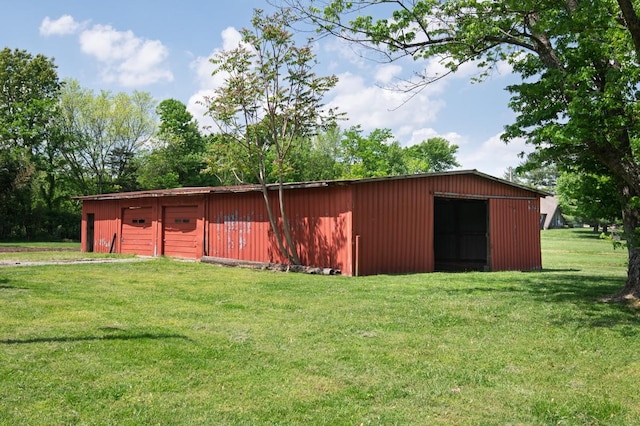 view of pole building with a lawn