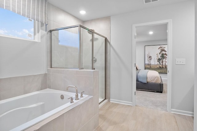 bathroom with a garden tub, visible vents, ensuite bathroom, recessed lighting, and a stall shower