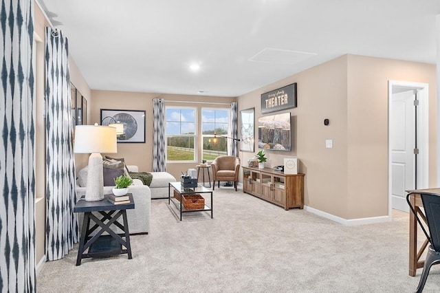 living room featuring carpet floors and baseboards