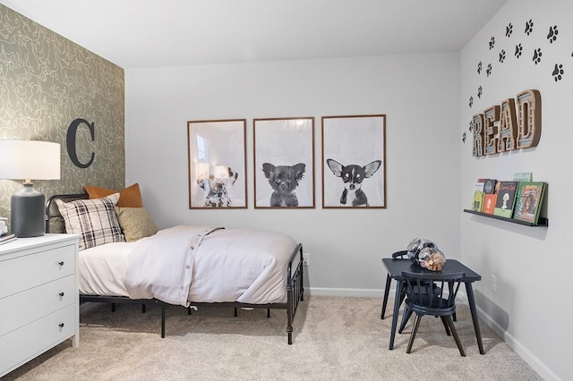 bedroom with baseboards, an accent wall, carpet, and wallpapered walls