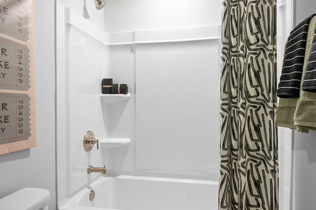 full bathroom featuring shower / bath combination with curtain and toilet