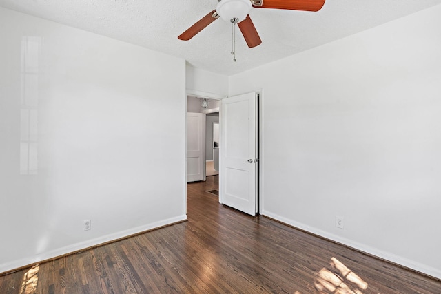 unfurnished room with baseboards, ceiling fan, and wood finished floors