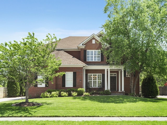 2835 Kaye Dr, Thompsons Station, TN 37179 - view of front of property with fence, a shingled roof, a front lawn, and brick siding
