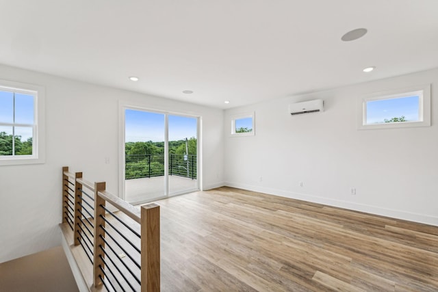 1303 Katie Ave Unit B, Nashville, TN 37207 - spare room featuring recessed lighting, baseboards, a wall unit AC, and light wood-type flooring