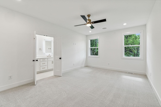 1303 Katie Ave Unit B, Nashville, TN 37207 - unfurnished bedroom featuring a sink, baseboards, and light colored carpet