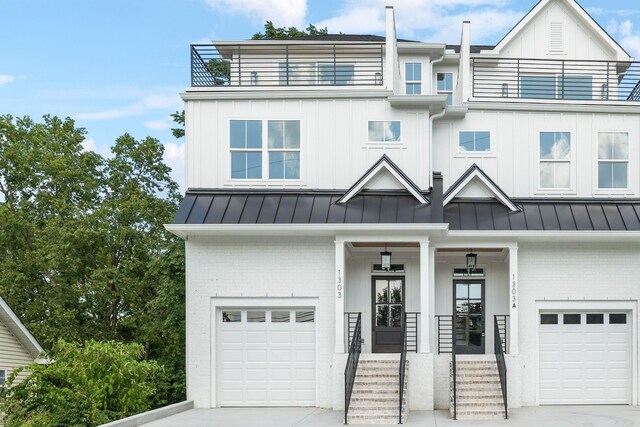 1303 Katie Ave Unit B, Nashville, TN 37207 - view of front of property with brick siding, a garage, a balcony, and a standing seam roof