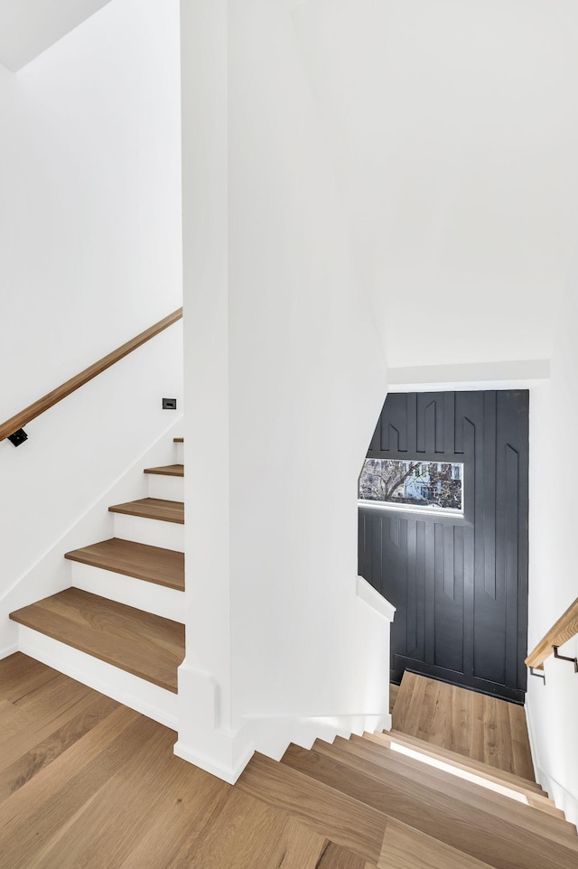 staircase with wood finished floors