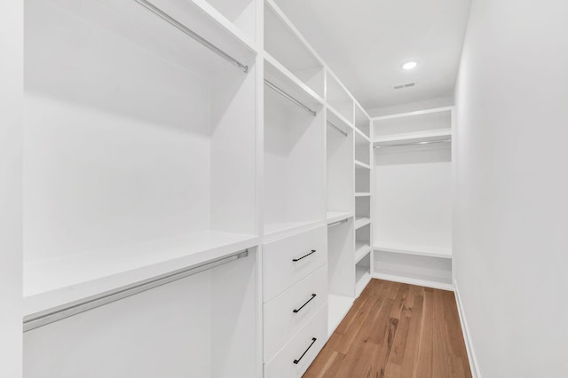 spacious closet with visible vents and light wood-style floors