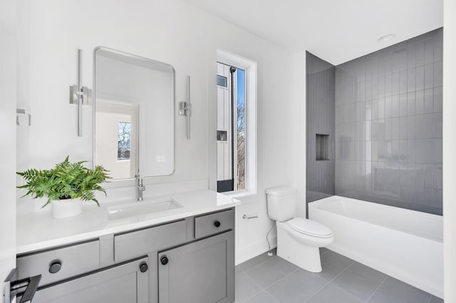 bathroom with tile patterned flooring, baseboards, vanity, toilet, and a wealth of natural light