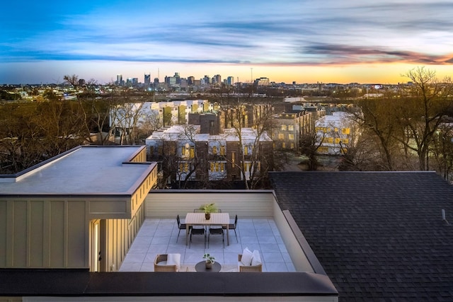 exterior space with a city view and outdoor dining area