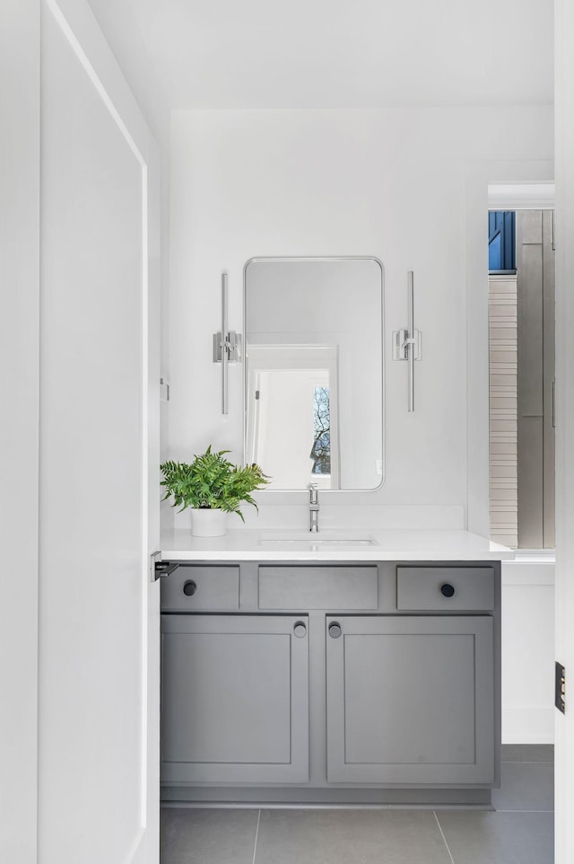 bathroom featuring tile patterned floors and vanity