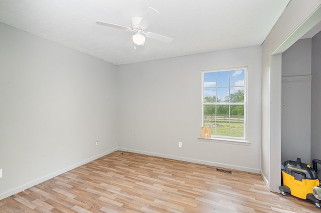 unfurnished bedroom with ceiling fan, baseboards, visible vents, and light wood-style flooring