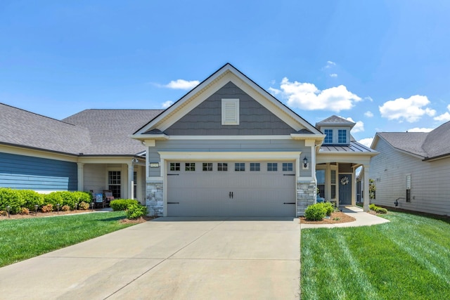 craftsman-style house with an attached garage, a front lawn, stone siding, a standing seam roof, and driveway
