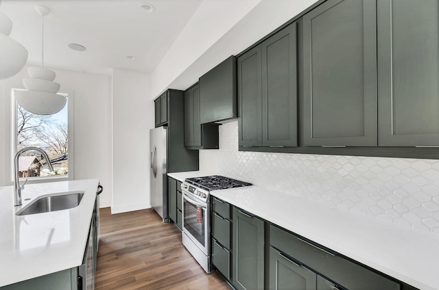 18 Willis St Unit C, Nashville, TN 37207 - kitchen featuring light countertops, a sink, appliances with stainless steel finishes, and tasteful backsplash