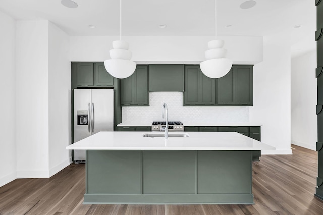 18 Willis St Unit C, Nashville, TN 37207 - kitchen with light countertops, green cabinetry, dark wood-style floors, and stainless steel fridge with ice dispenser
