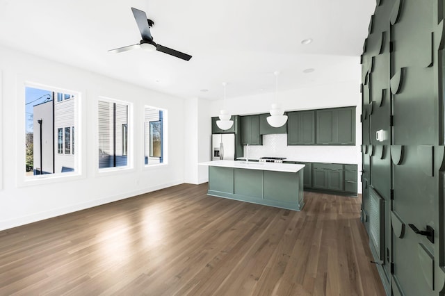 18 Willis St Unit C, Nashville, TN 37207 - kitchen with decorative backsplash, ceiling fan, light countertops, stainless steel fridge with ice dispenser, and dark wood-type flooring
