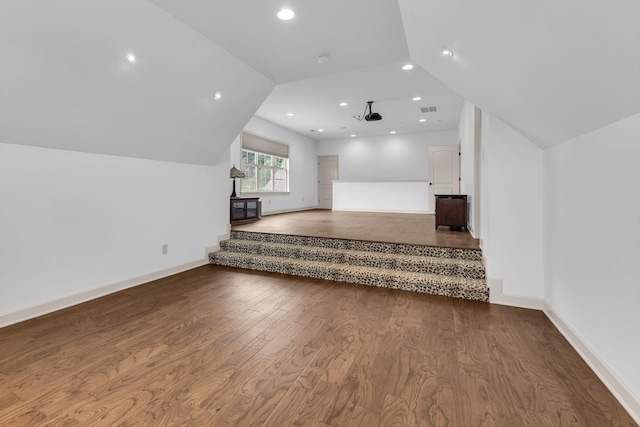 bonus room with visible vents, wood finished floors, baseboards, lofted ceiling, and recessed lighting