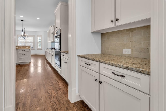 kitchen with recessed lighting, dark wood-style flooring, backsplash, and white cabinets