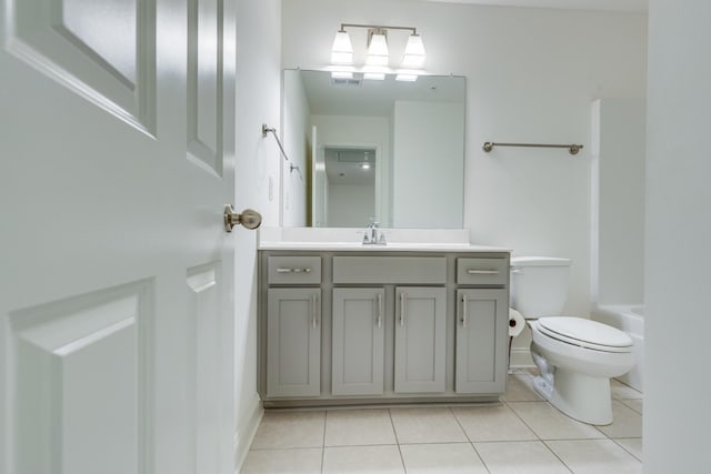 full bath with tile patterned floors, vanity, toilet, and visible vents