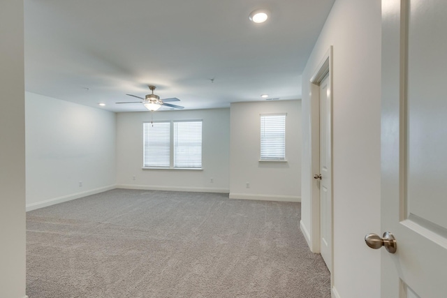 unfurnished room featuring baseboards, ceiling fan, light carpet, and recessed lighting