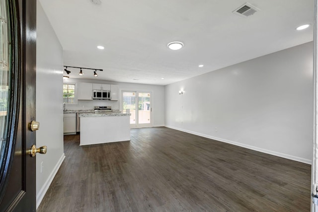 217 Sterry Ct, Antioch, TN 37013 - interior space with appliances with stainless steel finishes, baseboards, a kitchen island, and visible vents