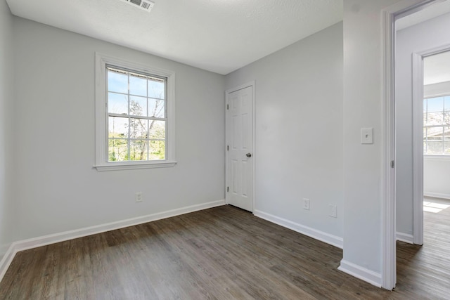 217 Sterry Ct, Antioch, TN 37013 - empty room featuring plenty of natural light, dark wood finished floors, baseboards, and visible vents