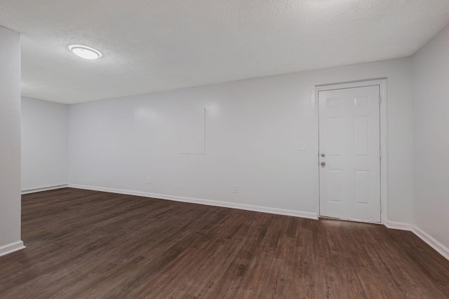 217 Sterry Ct, Antioch, TN 37013 - unfurnished room featuring baseboards, a textured ceiling, and dark wood finished floors