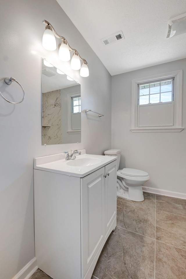 217 Sterry Ct, Antioch, TN 37013 - bathroom with visible vents, a wealth of natural light, toilet, and vanity