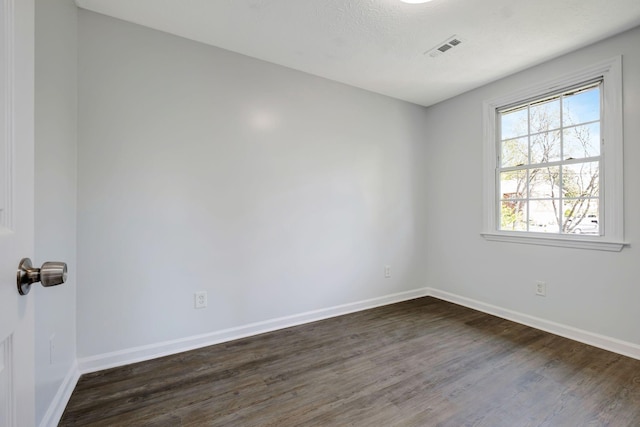 217 Sterry Ct, Antioch, TN 37013 - empty room with baseboards, dark wood-style flooring, and visible vents