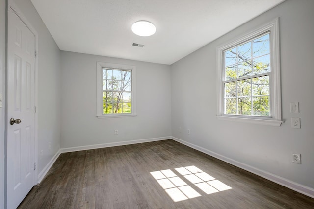 217 Sterry Ct, Antioch, TN 37013 - spare room with dark wood-style flooring, baseboards, and visible vents