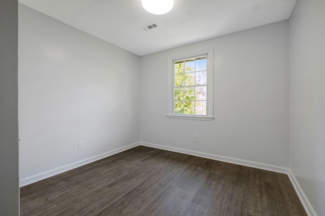 217 Sterry Ct, Antioch, TN 37013 - empty room with dark wood-style flooring, baseboards, and visible vents