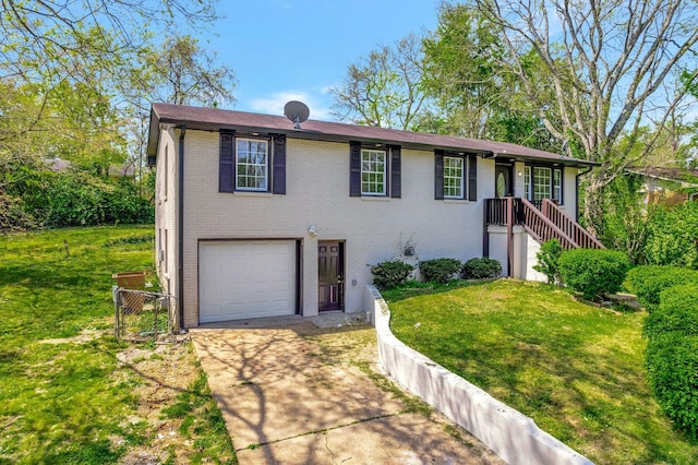 217 Sterry Ct, Antioch, TN 37013 - view of front of home with brick siding, driveway, a front yard, and a garage