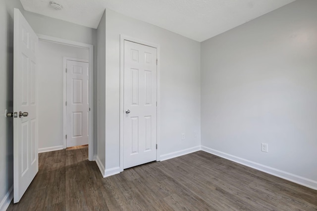 217 Sterry Ct, Antioch, TN 37013 - unfurnished bedroom featuring baseboards and wood finished floors