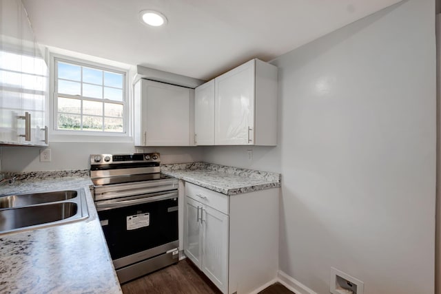 217 Sterry Ct, Antioch, TN 37013 - kitchen featuring light countertops, electric range, white cabinets, and dark wood-style floors
