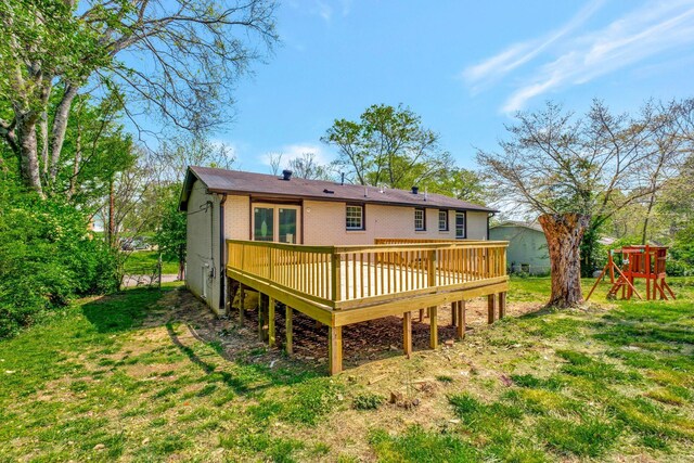 217 Sterry Ct, Antioch, TN 37013 - rear view of house featuring a lawn, a wooden deck, and brick siding
