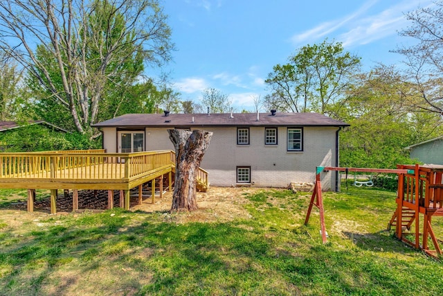 217 Sterry Ct, Antioch, TN 37013 - back of property featuring a lawn, a playground, a deck, and brick siding